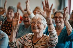 Older adults share a table activity while a caregiver reviews a daily schedule nearby.